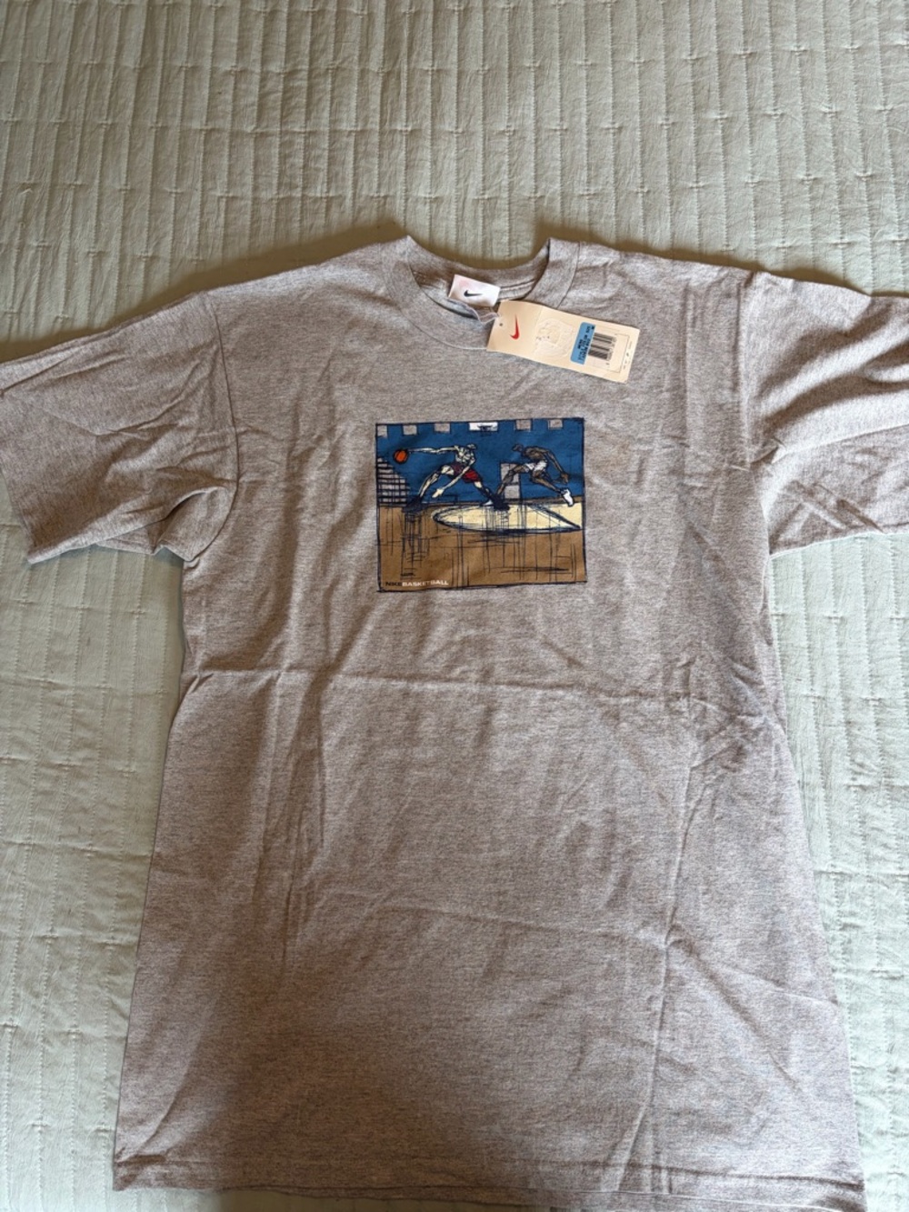 Nike Men’s Gray Short Sleeve Tee with Blue Basketball Graphic